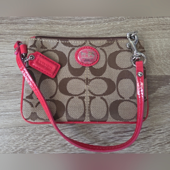 Coach Handbags - Coach Brown Signature Canvas Wristlet with Red Trim